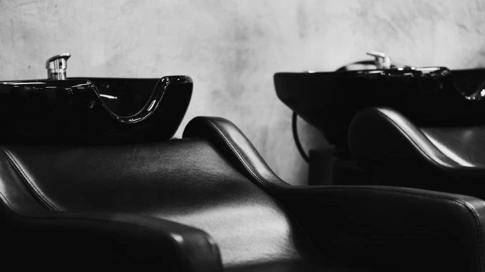 black sunglasses on black leather chair